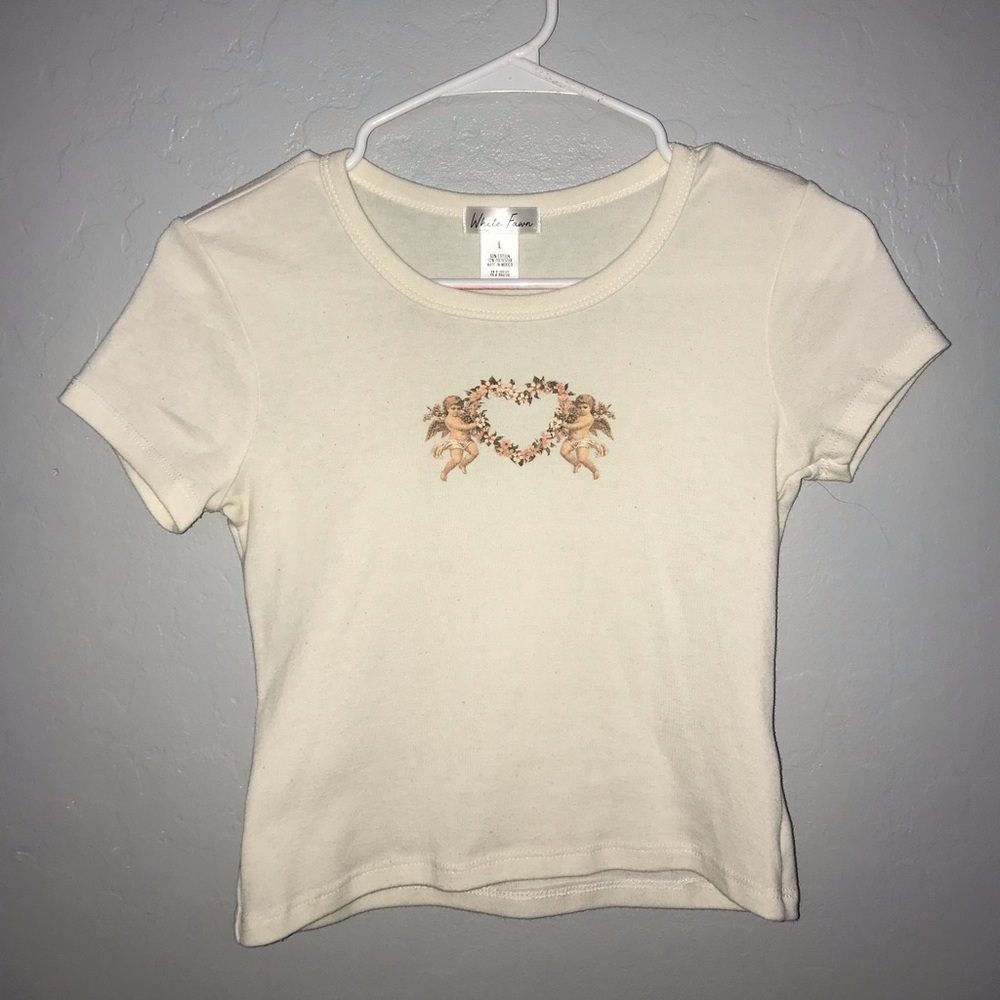 White Fawn floral angel shirt, children’s size large, color is cream